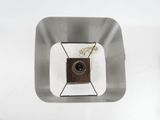 an overhead view of a square metal object with a wire in the middle