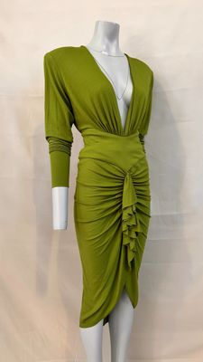 a woman ' s green dress on a mannequin mannequin mannequin mannequin mannequin mannequin mannequin mannequin