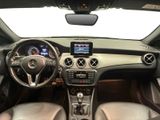 the interior of a car with a steering wheel, dashboard, and dashboard controls