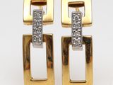 pair of gold and diamond earrings