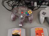 two game controllers sitting next to each other on a table