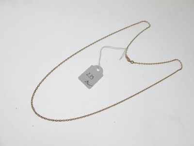 gros plan d'un collier auquel est attachée une étiquette