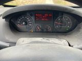 dashboard view of a car with a steering wheel and gauges