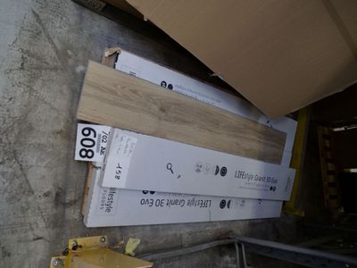 several pieces of wood are stacked on top of each other in a warehouse