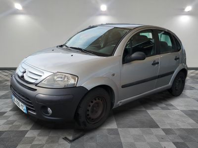 a picture of a small car parked in a garage