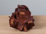 a small wooden sculpture of a bear on a table