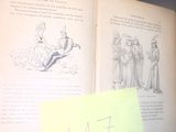 un livre ouvert sur lequel figure le dessin d'un homme