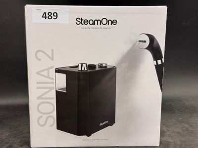 the box of a black and white product is open on the table
