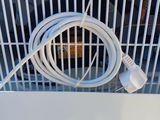 an air conditioner with a white cord attached to it