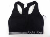 a close up of a black sports bra top on a white background