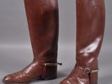 pair of brown leather riding boots with buckles and buckles