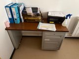 a desk with a file cabinet and a printer on it