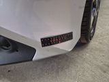 a close up of a car ' s bumper with a sticker on it