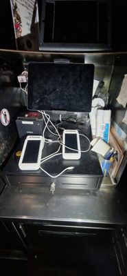 a laptop computer sitting on top of a black desk