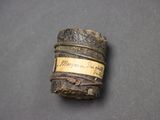a small piece of wood with a label on it