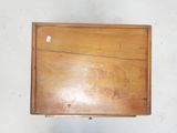 a small wooden box with a handle on it