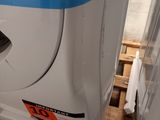 a white refrigerator with a blue stripe on the side