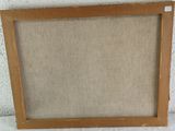 an old picture frame is sitting on a white surface