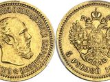 a gold coin with the image of a man and a bird on it
