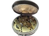 a silver pocket watch with a key in it