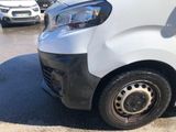 a white van that is parked in a parking lot