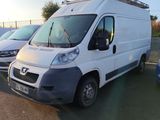 two vans parked in a parking lot next to each other