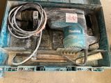 a tool in a box that is sitting on the floor
