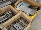 many boxes of tools sitting on the floor in the garage
