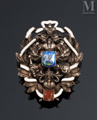 an image of a silver broochle with a coat of arms on it