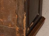 an old wooden door with peeling paint on it