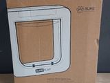 cardboard box with a picture of a microwave inside of it on a table