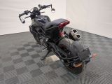 a picture of a motorcycle parked on a checkered floor