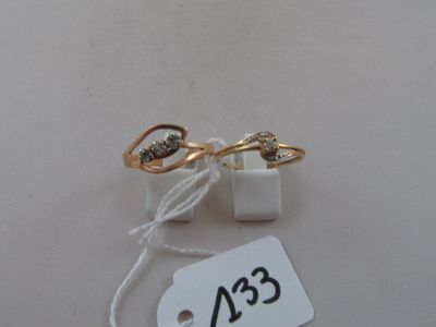 a pair of earrings with a price tag attached to them