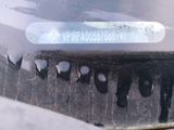 a close up of a car ' s bumper with a sticker on it