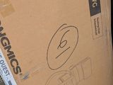 a box that is sitting on the ground next to a pile of boxes