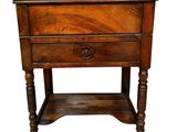 an old wooden table with a drawer on top of it