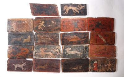 many pieces of art on the wall of this room