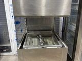 a stainless steel sink and freezer in a store