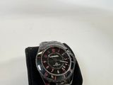 a watch that is sitting on top of a black case