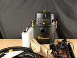 a close up of a table with a vacuum and other items on it