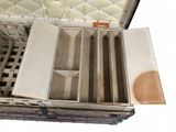 an open suitcase that has a bunch of compartments inside of it