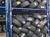many tires stacked on a rack in a warehouse