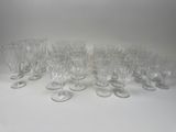 a lot of empty wine glasses sitting on a table
