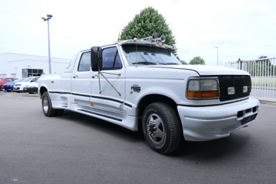 a white truck that is parked in a parking lot