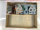 a box with a doll house in it on a table