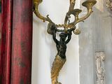 a picture of a candle holder on a wall in a room