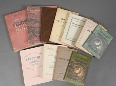 several books are stacked on top of each other on a table