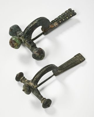pair of antique bronze hair clips with green and black pating