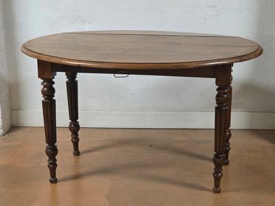 a small table with a wooden top on a hard wood floor