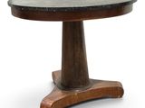a wooden table with a black marble top on a white background